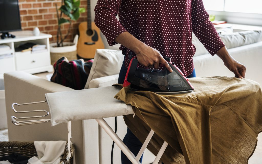 Black woman cleaning home housework