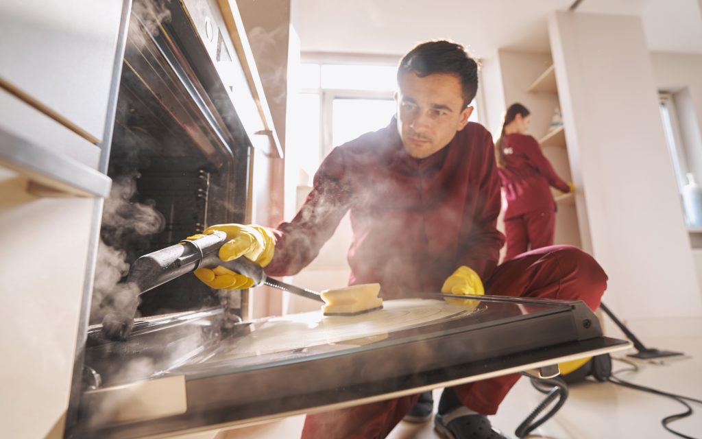 Professional janitorial personnel doing eco-friendly kitchen cleaning